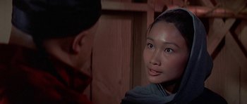 Movie still from “The Hawaiians” (1970), directed by Tom Gries – A young asian woman looking at a man; Close Up shot, Over the shoulder angle