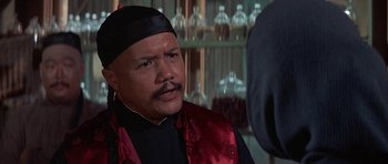 Movie still from “The Hawaiians” (1970), directed by Tom Gries – A person wearing a black hat; Close Up shot, Over the shoulder angle