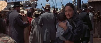 Movie still from “The Hawaiians” (1970), directed by Tom Gries – A group of people walking down a street; Close Up shot, Over the shoulder angle