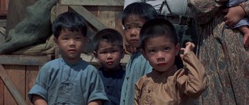 Movie still from “The Hawaiians” (1970), directed by Tom Gries – A group of young asian boys standing next to each other; Close Up shot, High angle