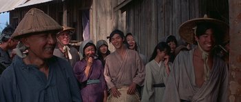 Movie still from “The Hawaiians” (1970), directed by Tom Gries – A group of people standing next to each other; Medium shot, Over the shoulder angle