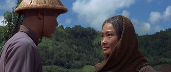 Movie still from “The Hawaiians” (1970), directed by Tom Gries – Two people talking to each other in front of a forest; Close Up shot, Over the shoulder angle