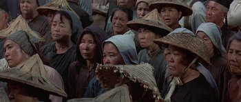 Movie still from “The Hawaiians” (1970), directed by Tom Gries – A group of people wearing hats and standing in a crowd; Medium shot, High angle