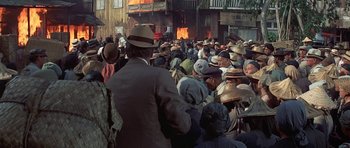 Movie still from “The Hawaiians” (1970), directed by Tom Gries – A group of people standing in a crowd next to a building; Wide shot, High angle