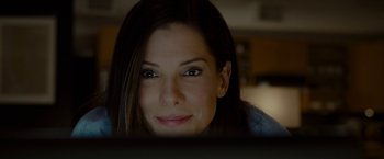Movie still from “The Heat” (2013), directed by Paul Feig – A person sitting in front of a computer; Close Up shot, Over the shoulder angle