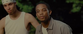 Movie still from “The Heat” (2013), directed by Paul Feig – A young man is posing for a picture; Close Up shot, Over the shoulder angle