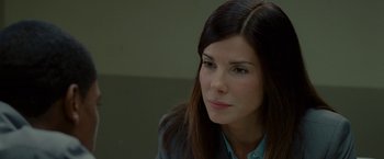 Movie still from “The Heat” (2013), directed by Paul Feig – A person wearing a jacket; Close Up shot, Over the shoulder angle