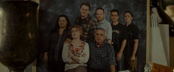 Movie still from “The Heat” (2013), directed by Paul Feig – A group of men and women posing for a picture; Medium shot, High angle