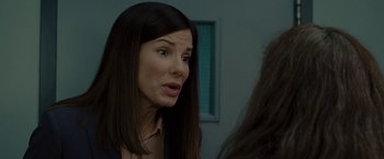 Movie still from “The Heat” (2013), directed by Paul Feig – A person talking to another person; Close Up shot, Over the shoulder angle