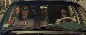 Movie still from “The Heat” (2013), directed by Paul Feig – A group of people and a dog in the back of a car; Medium shot, Over the shoulder angle
