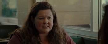 Movie still from “The Heat” (2013), directed by Paul Feig – A person with long brown hair; Close Up shot, Over the shoulder angle