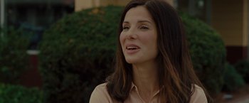 Movie still from “The Heat” (2013), directed by Paul Feig – A person with long hair; Close Up shot, Over the shoulder angle