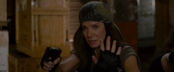 Movie still from “The Heat” (2013), directed by Paul Feig – A woman holding a cell phone in her hand; Close Up shot, Over the shoulder angle