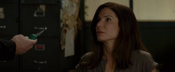 Movie still from “The Heat” (2013), directed by Paul Feig – A person with long brown hair; Close Up shot, Over the shoulder angle