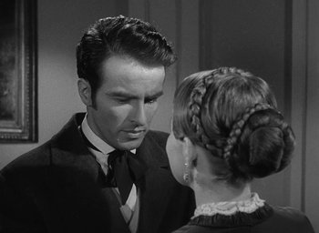 Movie still from “The Heiress” (1949), directed by William Wyler – A black and white photo of a man and a woman; Close Up shot, Over the shoulder angle