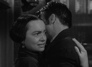 Movie still from “The Heiress” (1949), directed by William Wyler – A man and a woman embracing each other; Close Up shot, High angle