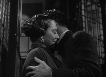 Movie still from “The Heiress” (1949), directed by William Wyler – A man and a woman embracing each other; Close Up shot, Low angle