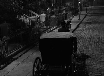 Movie still from “The Heiress” (1949), directed by William Wyler – A horse drawn carriage on the side of the road; Wide shot, High angle