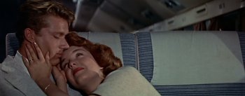 Movie still from “The High and the Mighty” (1954), directed by William A. Wellman – A person laying on a couch; Close Up shot, Overhead angle