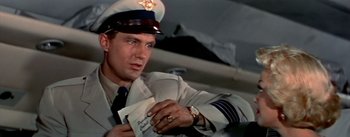 Movie still from “The High and the Mighty” (1954), directed by William A. Wellman – A person wearing a uniform; Close Up shot, Low angle