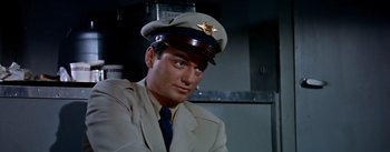 Movie still from “The High and the Mighty” (1954), directed by William A. Wellman – A person wearing a uniform; Close Up shot, Low angle