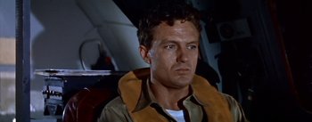 Movie still from “The High and the Mighty” (1954), directed by William A. Wellman – A person wearing a jacket; Close Up shot, Low angle