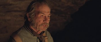 Movie still from “The Homesman” (2014), directed by Tommy Lee Jones – An old man with a beard and a tie; Close Up shot, Low angle