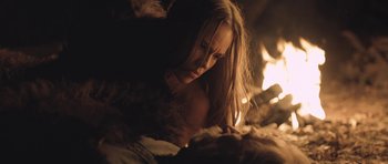 Movie still from “The Homesman” (2014), directed by Tommy Lee Jones – A woman laying on a bed next to a fireplace; Close Up shot, Over the shoulder angle