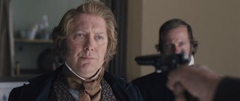 Movie still from “The Homesman” (2014), directed by Tommy Lee Jones – A person wearing a neck tie; Close Up shot, Over the shoulder angle