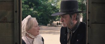 Movie still from “The Homesman” (2014), directed by Tommy Lee Jones – An older man and a younger woman are talking; Close Up shot, Over the shoulder angle