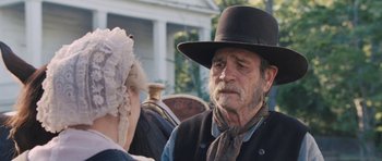 Movie still from “The Homesman” (2014), directed by Tommy Lee Jones – An older man and woman talking in front of a carriage; Close Up shot, Over the shoulder angle
