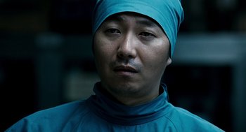Movie still from “The Host” (2006), directed by Bong Joon Ho – A person wearing a head covering; Close Up shot, Low angle