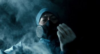 Movie still from “The Host” (2006), directed by Bong Joon Ho – A person wearing a gas mask in the dark; Close Up shot, Low angle