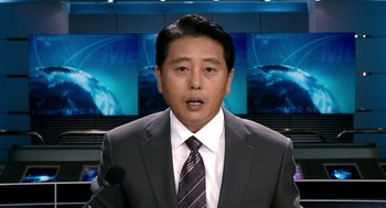 Movie still from “The Host” (2006), directed by Bong Joon Ho – A man wearing a suit and tie in front of a microphone; Close Up shot, Low angle