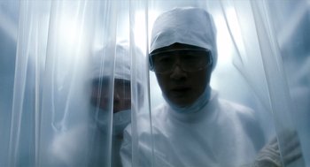 Movie still from “The Host” (2006), directed by Bong Joon Ho – Two men in white lab coats and white hats; Medium shot, Low angle