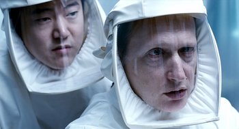 Movie still from “The Host” (2006), directed by Bong Joon Ho – A man in a white suit is looking into a mirror; Close Up shot, Over the shoulder angle