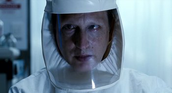 Movie still from “The Host” (2006), directed by Bong Joon Ho – A person wearing a white suit and a white helmet; Close Up shot, Over the shoulder angle