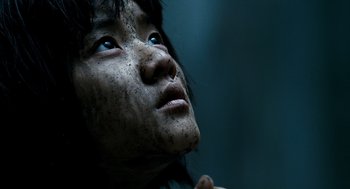 Movie still from “The Host” (2006), directed by Bong Joon Ho – A person looking up at the sky; Extreme Close Up shot, Low angle