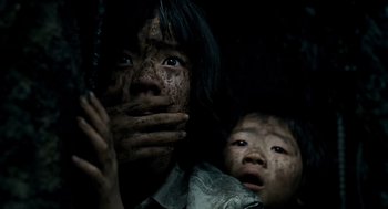 Movie still from “The Host” (2006), directed by Bong Joon Ho – A woman and a child are covered in mud; Close Up shot, Low angle