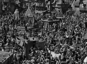 Movie still from “The Hunchback of Notre Dame” (1939), directed by William Dieterle – A crowd of people gathered in a large area; Extreme Wide shot, High angle