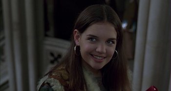 Movie still from “The Ice Storm” (1997), directed by Ang Lee – A young woman smiles for the camera; Close Up shot, Over the shoulder angle