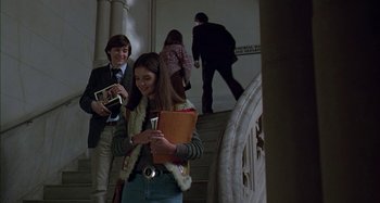 Movie still from “The Ice Storm” (1997), directed by Ang Lee – A group of people standing on a set of stairs; Medium shot, High angle
