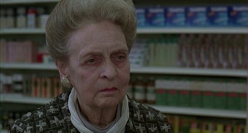 Movie still from “The Ice Storm” (1997), directed by Ang Lee – An old woman with a very large forehead; Close Up shot, Low angle