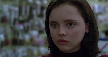 Movie still from “The Ice Storm” (1997), directed by Ang Lee – A person looking at the camera; Close Up shot, Over the shoulder angle