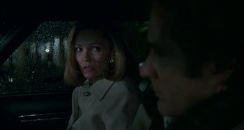 Movie still from “The Ice Storm” (1997), directed by Ang Lee – A woman sitting next to a man in the back of a car; Close Up shot, Over the shoulder angle
