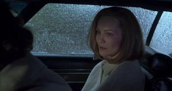 Movie still from “The Ice Storm” (1997), directed by Ang Lee – A woman sitting in the driver's seat of a car; Close Up shot, Over the shoulder angle