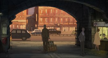 Movie still from “The Illusionist” (2010), directed by Sylvain Chomet – A man standing under an overpass holding a suitcase; Wide shot, Low angle