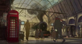 Movie still from “The Illusionist” (2010), directed by Sylvain Chomet – People are walking in a train station while a train is coming up the tracks; Wide shot, High angle