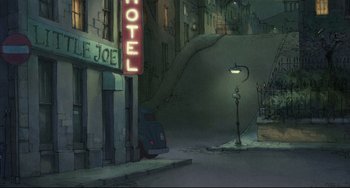 Movie still from “The Illusionist” (2010), directed by Sylvain Chomet – An old motel sign on the side of the street; Extreme Wide shot, High angle