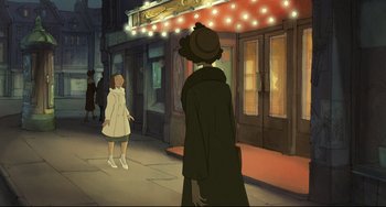Movie still from “The Illusionist” (2010), directed by Sylvain Chomet – Two people are standing outside of a movie theater at night; Wide shot, High angle